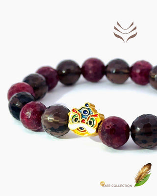 Elegant Light-Coded Property Mixel bracelet with ruby and smokey quartz beads, accented by a gold-tone charm for healing and investment luck.