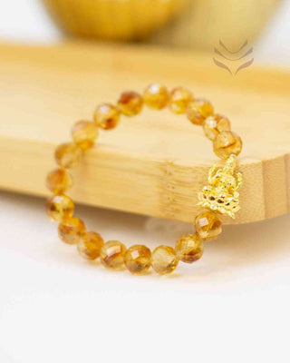 Golden Lakshmi charm bracelet with citrine beads