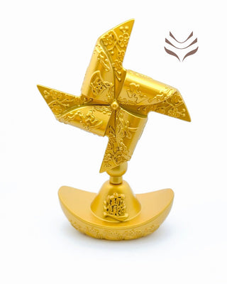 Golden feng shui fan with decorative engravings on a gold ingot base, ideal for dispelling bad luck and inviting prosperity.