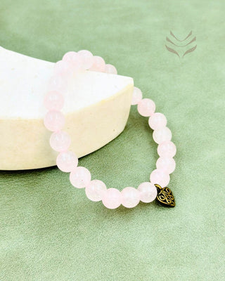 Rose quartz crystal bracelet with heart charm