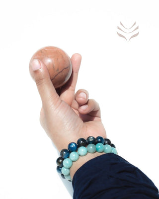 Hand holding Light-Coded Sunstone Sphere