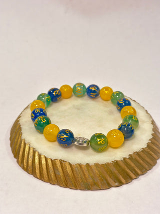 3 in 1 - Buddha Bracelet  A unique bracelet with the inscription of Om Mani Padme Hum mantra on multiple beads of Green Aventurine, Blue Agate,Yellow Jade.